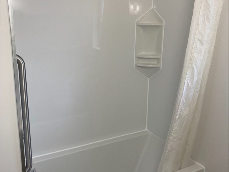 Retro-style guest room featuring a full bathroom at 2400 Motel