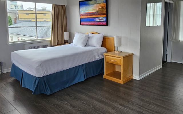 Spacious one-bedroom suite with living area at 2400 Motel