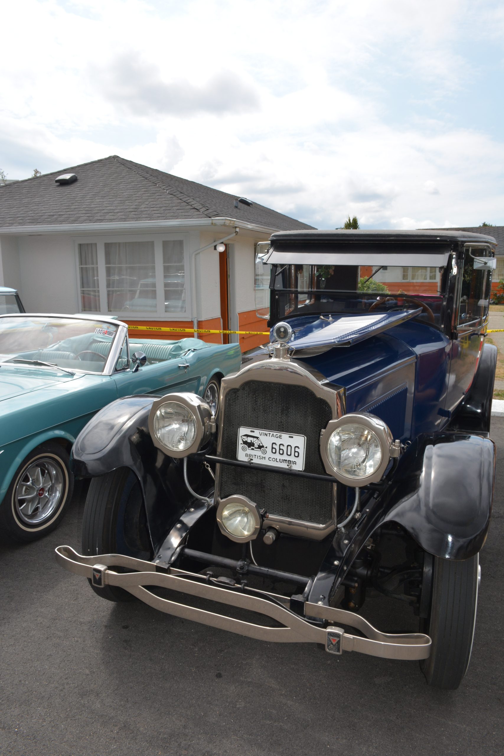 Retro vehicles displayed outside 2400 Motel bungalows